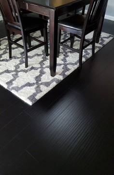 Wide plank laminate floors with grain-patterns, and a handscraped surface that mimics the look of exotic  hardwood.