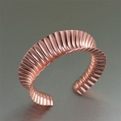 With both contemporary allure and classic appeal, this eye-catching #anticlastically raised handmade #copper #cuff bracelet is sure to make a statement. Simply stunning, this bracelet features a deep textured pattern that gleams a rose gold like hue.