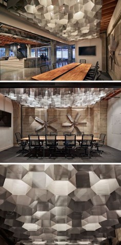 19 Ideas For Using Hexagons In Interior Design And Architecture // Metal hexagon-shaped lights have been used as an artistic feature in this meeting room.