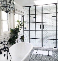 Bathroom with black hardware, black framed shower doors, black and white patterned encaustic tile floor, designed by Life Style LA, via @Sarah Sarna - Fashion, Interior Design, + Beauty 