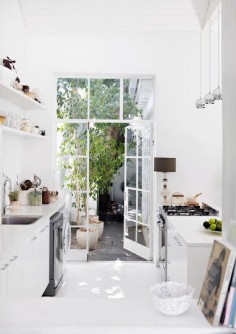 Bright and open all-white kitchen.