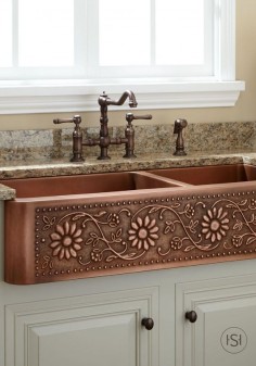 Bring warmth and style to your cottage-chic kitchen with a copper farmhouse sink with a sunflower design. Start planning your new kitchen renovation by re-pinning this lovely and unique sink.
