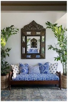 British Colonial Caribbean Decor | blue and white daybed decor with dark wood ornate furniture - always like that touch of blue