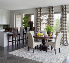 Dining Room | Geometric Circle Drapery Panels, Beige Leather Dining Chairs, Dark Wood Round Pedestal Dining Table
