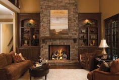 Fireplace with different stone. have stone go to ceiling. windows next to fireplace then built ins with base cabinets from wall to fireplace