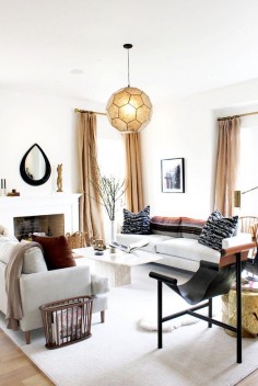 Geometric light fixture in warm and neutral living room