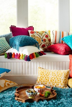 Here's another easy way to get the instant boho feel: Mix and match vibrant colors and intricate patterns with a smattering of pillows in your reading nook. And don't forget the tassels--like the multicolored ones adorning Pier 1's Boho Tassel Pillow.