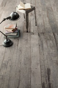 This incredible distressed wood floor has a secret. It's not really wood. It's wood looking tile. Introducing Blendart - the new porcelain tile collection by Ceramica Sant'Agostino. The 
