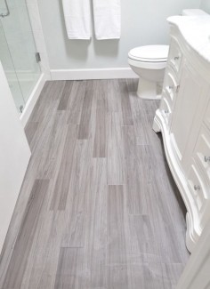 vinyl plank bathroom floor ... budget friendly modern vinyl plank product. These are Trafficmaster Allure in Grey Maple installed in a random offset pattern like hardwood. Available at Home Depot,