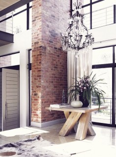washed brick pilar* chandelier* contrast* table*