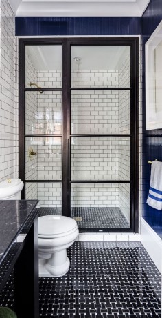 White subway tiles in navy and white bathroom